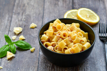  Italian home made   pasta  with  lemon  tuna  fish, parmesan cheese and black pepper .