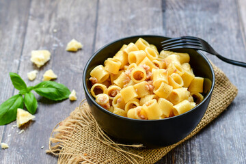  Italian home made   pasta  with  lemon  tuna  fish, parmesan cheese and black pepper .