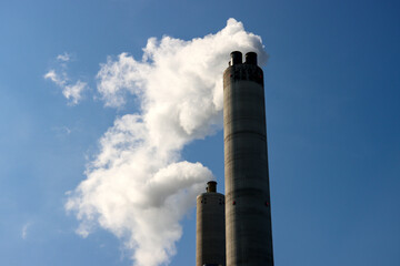 Steam from the chimney of waste incineration AEB in Amsterdam - obrazy, fototapety, plakaty