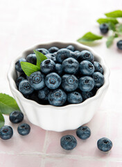 Blueberries on tile background