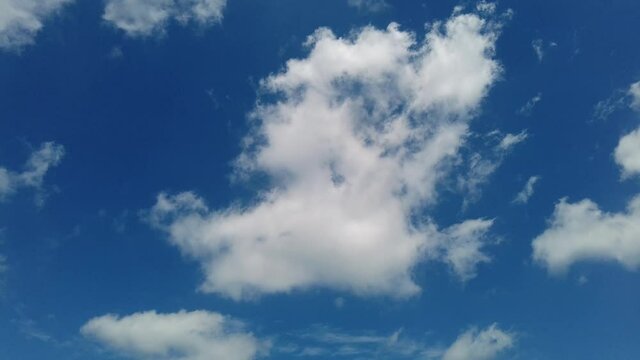 Panorama of blue sky with white clouds in natural landscape. Lake Bracciano in Italy.