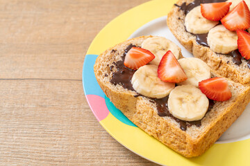 whole wheat bread with fresh banana, strawberry and chocolate