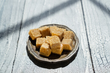 Vintage table setting with brown sugar for coffee or tea