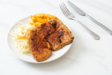 grilled spicy barbecue pork steak with french fries