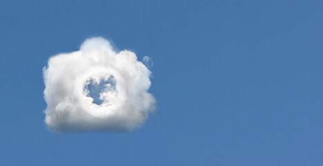 Cloud in the form of a camera in the blue sky.