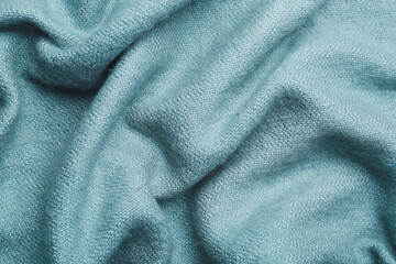 Texture of color fabric with folds as background, closeup