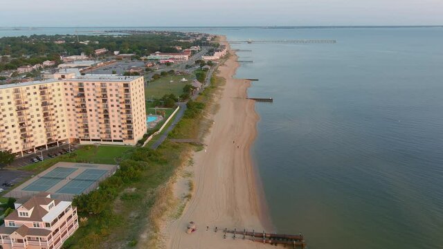 Drone Flight At Ocean View In Norfolk Virginia Headed West, Along The Beach Towards The Hampton Roads Bridge Tunnel , Featuring The Largest Residential Building In The Ocean View Area