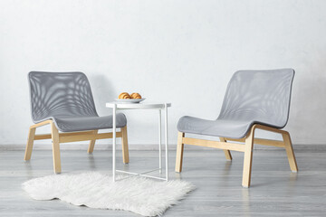 Fototapeta premium Interior of modern room with armchairs and table