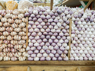 Stacked garlic displayed for sale in market