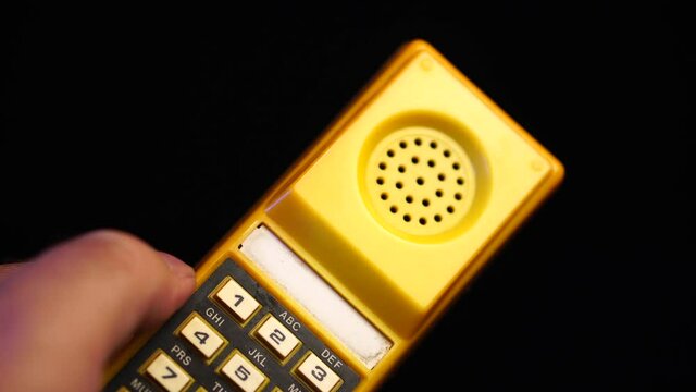Dialing 911 on Vintage Speed Dial Telephone Device From 1980s, Close Up