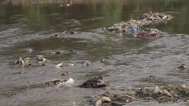 Garbage Waste Dumped In River At A Slum Destination In Pakistan