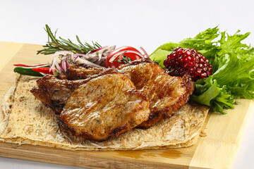 Grilled pork loin served onion