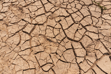 Top view of brown dried fracture ground land drought