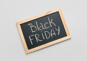 Chalkboard with text BLACK FRIDAY on light background