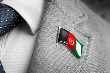 Metal badge with the flag of Afghanistan on a suit lapel