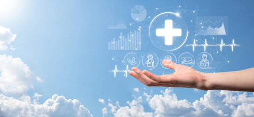 Businessman hold virtual plus medical network connection icons. Covid-19 pandemic develop people awareness and spread attention on their healthcare.Doctor,document,medicine,ambulance,patient icon.