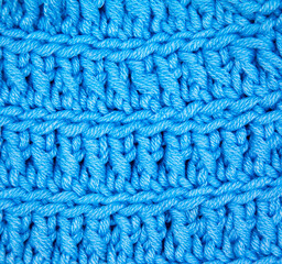 Handmade knitted fabric blue wool background texture