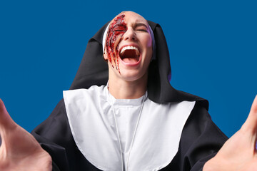 Screaming woman dressed for Halloween as nun on color background