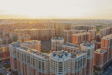 Endless multi-storey residential buildings, urban development at sunset.