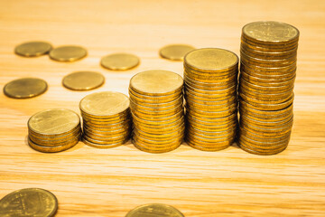 Gold coins stacks is representing riches and wealth management. Coin stack growing and find out the way to get a return on investment. Finance and money exchange investment as concept.	
