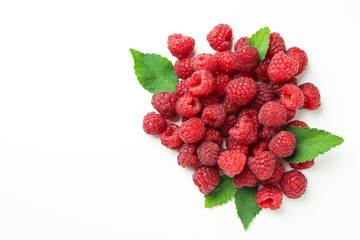A handful of red juicy raspberries on a white background, close up