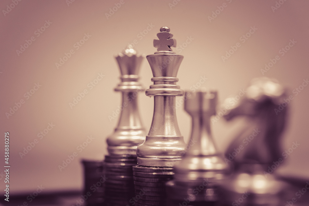 Poster closeup of chess characters on board games. to represent decision making in term of business strateg