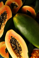 Fresh ripe papaya with leaves, close up