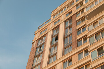 Fototapeta na wymiar Modern multi - storey building against blue sky