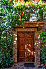 Fototapeta premium The door of an old house in Castel Gandolfo, a medieval village in the province of Rome, Italy.