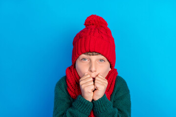 Photo portrait little boy wearing red headwear scarf trembling on frost isolated bright blue color...