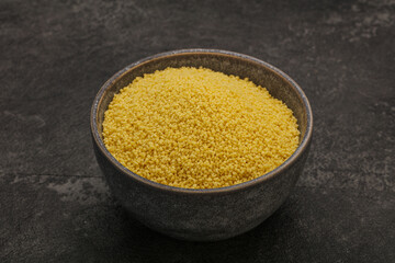 Raw cous cous heap in the bowl