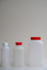 Set of plastic bottles for water analysis in France. Drinking water analysis. Copy space.  Vertical image. 