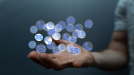 Hand holding using mobile phone with email icon on screen. Concept of business communication