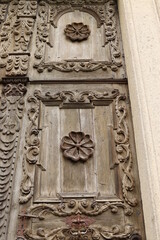 detail of a wooden relief on the door of a church
