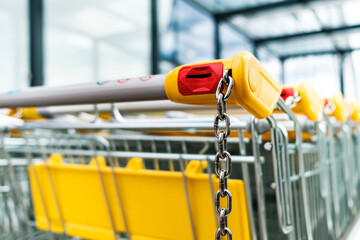 Shopping carts of a supermarket in a row, close up - 458889845