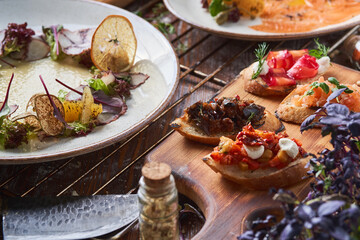 Italian food on the table. Carpaccio, bruschetta, cheese, seafood