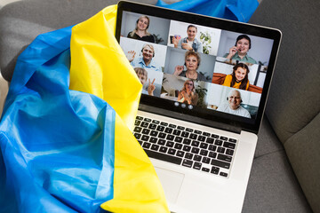 laptop with video near the flag of ukraine