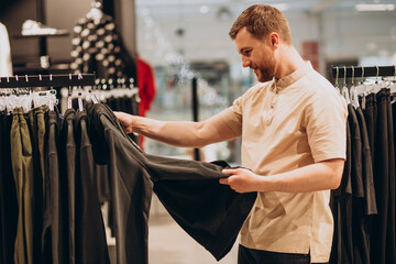 Young man shopping at sportswear shop
