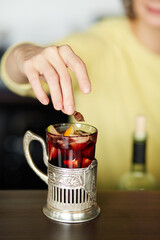 in mulled wine add a piece of temyan in a glass © Aleksandr