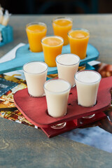 set of alcoholic sets on a wooden stand for the drinks menu of the restaurant or pub