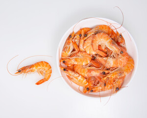 Red sea shrimp in dish on the white background