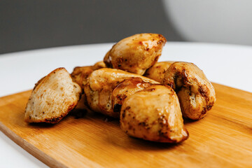 chicken skewers on a wooden board