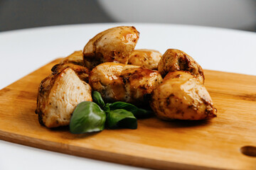 chicken skewers on a wooden board