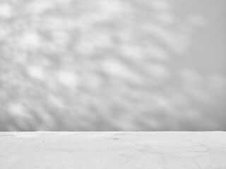 Gray concrete background with natural shadows for product presentation