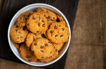 Fresh crispy chocolate cookies in a white deep plate