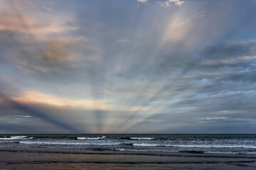 Sunbeams at Woodend Beach, south island, New Zealand.