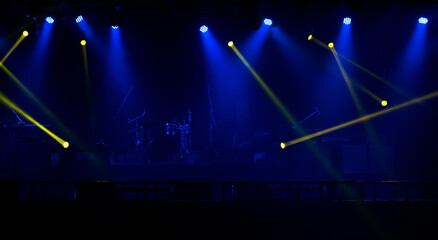 Blue and yellow stage lights with smoke.
