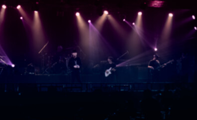 Fototapeta na wymiar Defocused entertainment concert lighting on stage.