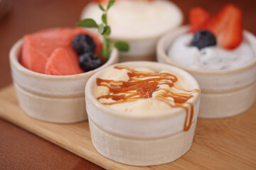 different ice cream in bowls is on the table