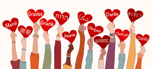Raised arms and hands of multi-ethnic people from different nations and continents holding heart with text -thank you- in various international languages.Communication.Equality. Allyship